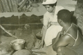 District Nurse boiling instruments in Tanganyika - 1950s