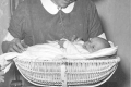 04_Weighing a baby in a wicker basket, 1932 (copyright Ian Smith)