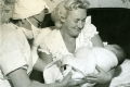 Midwife with mother and baby, 1960s.